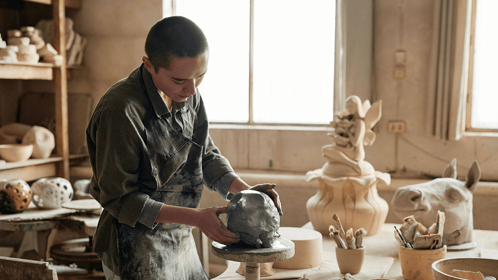 woman making sculpture